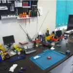 FPV drone build workbench with soldering station and tools at Aerobot Labs